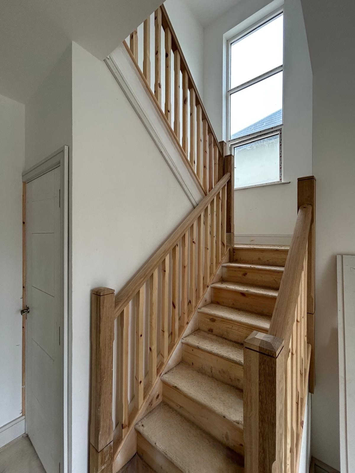 Finished stairwell with balustrade and natural light