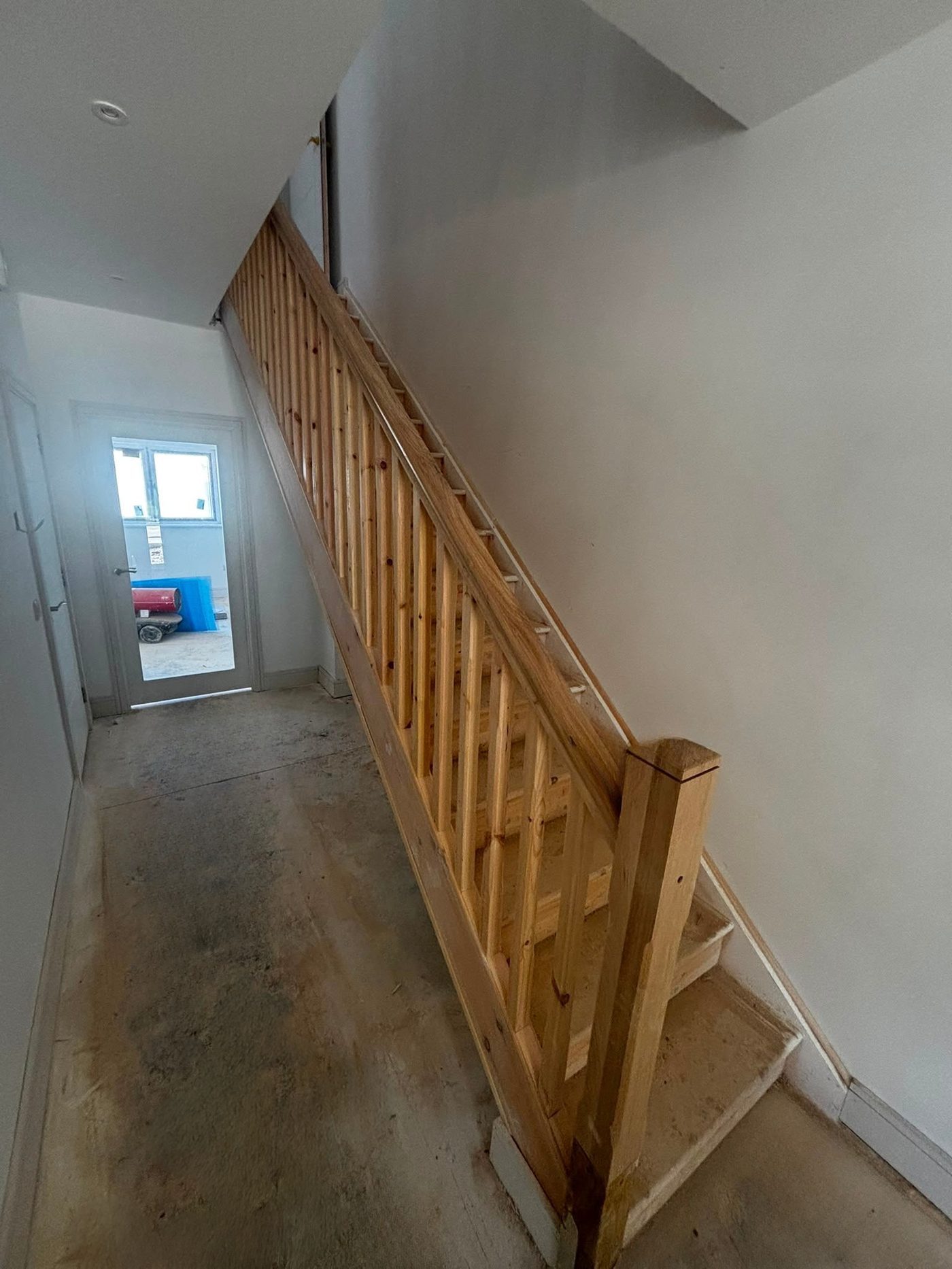 Staircase fitted mid-build, ahead of flooring and finishes