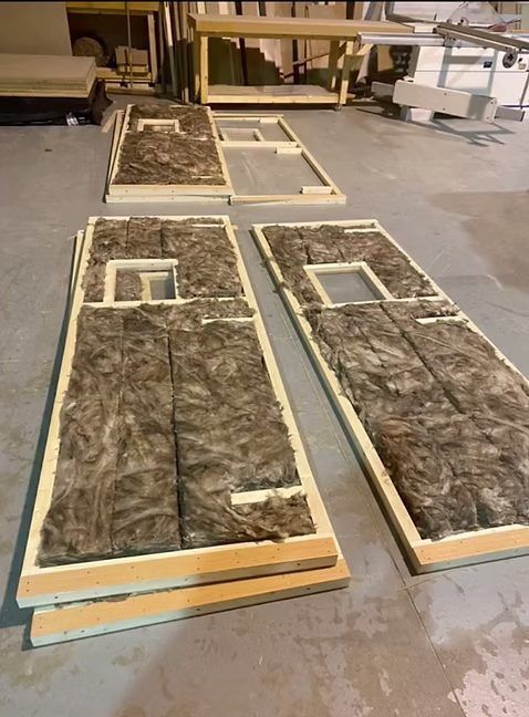 Insulated temporary door panels in fabrication